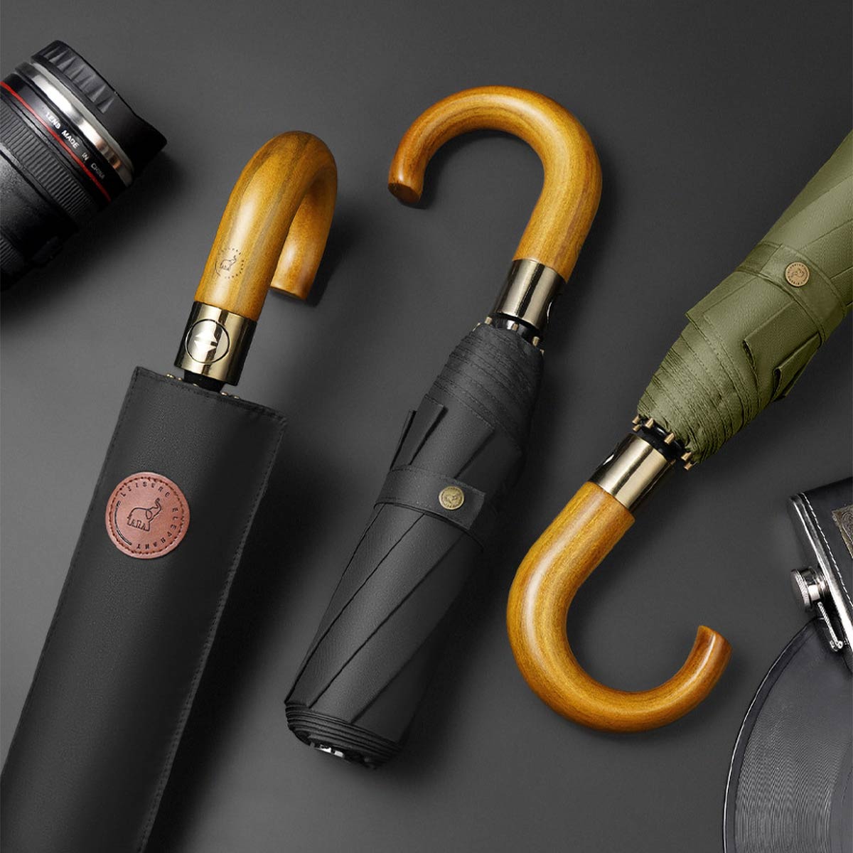 Classic Storm Proof Folding Umbrellas in black and olive with solid wooden handle and matching sleeves