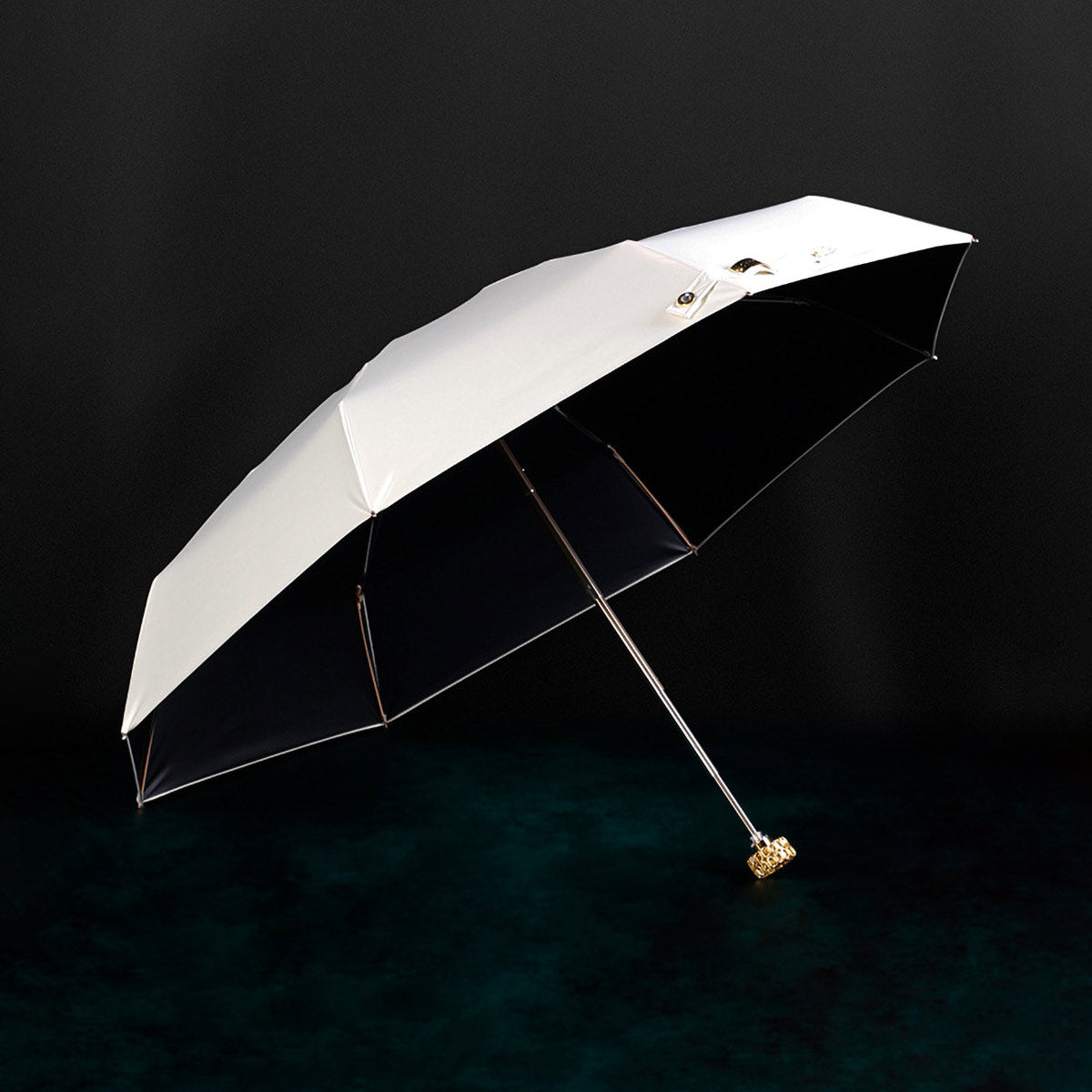 Portable designer umbrella featuring golden crystal handle - White