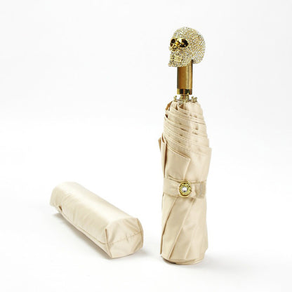 Off white luxury folding umbrella with crystal skull handle and storage case