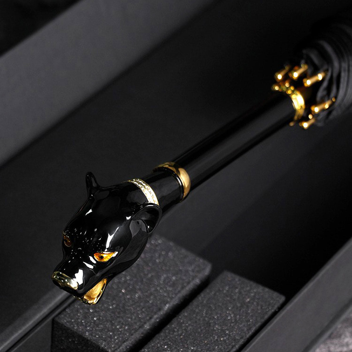 Elegant Black Umbrella with Gold Accents displaying sleek luxury design