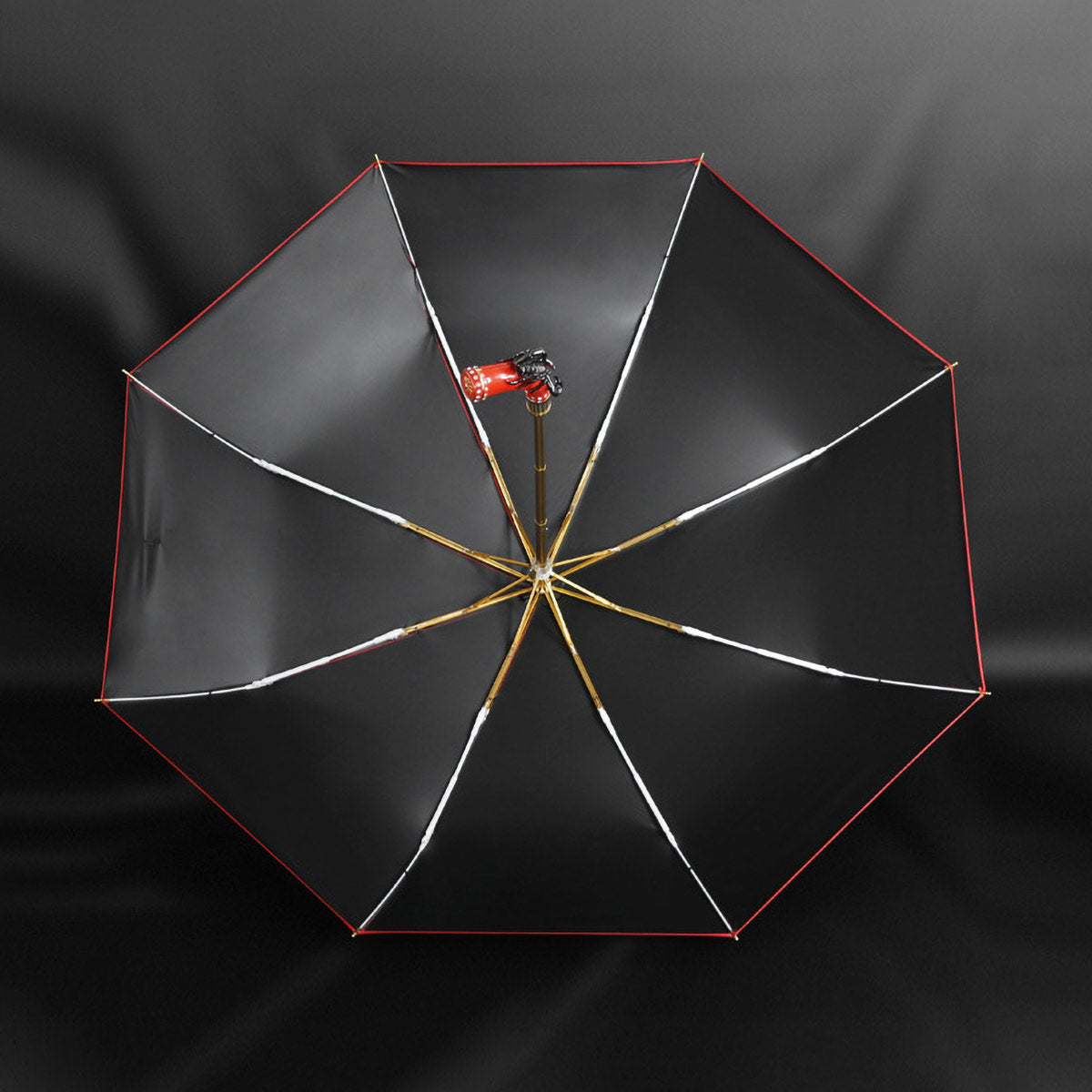 Unique red umbrella featuring a stylish scorpion handle