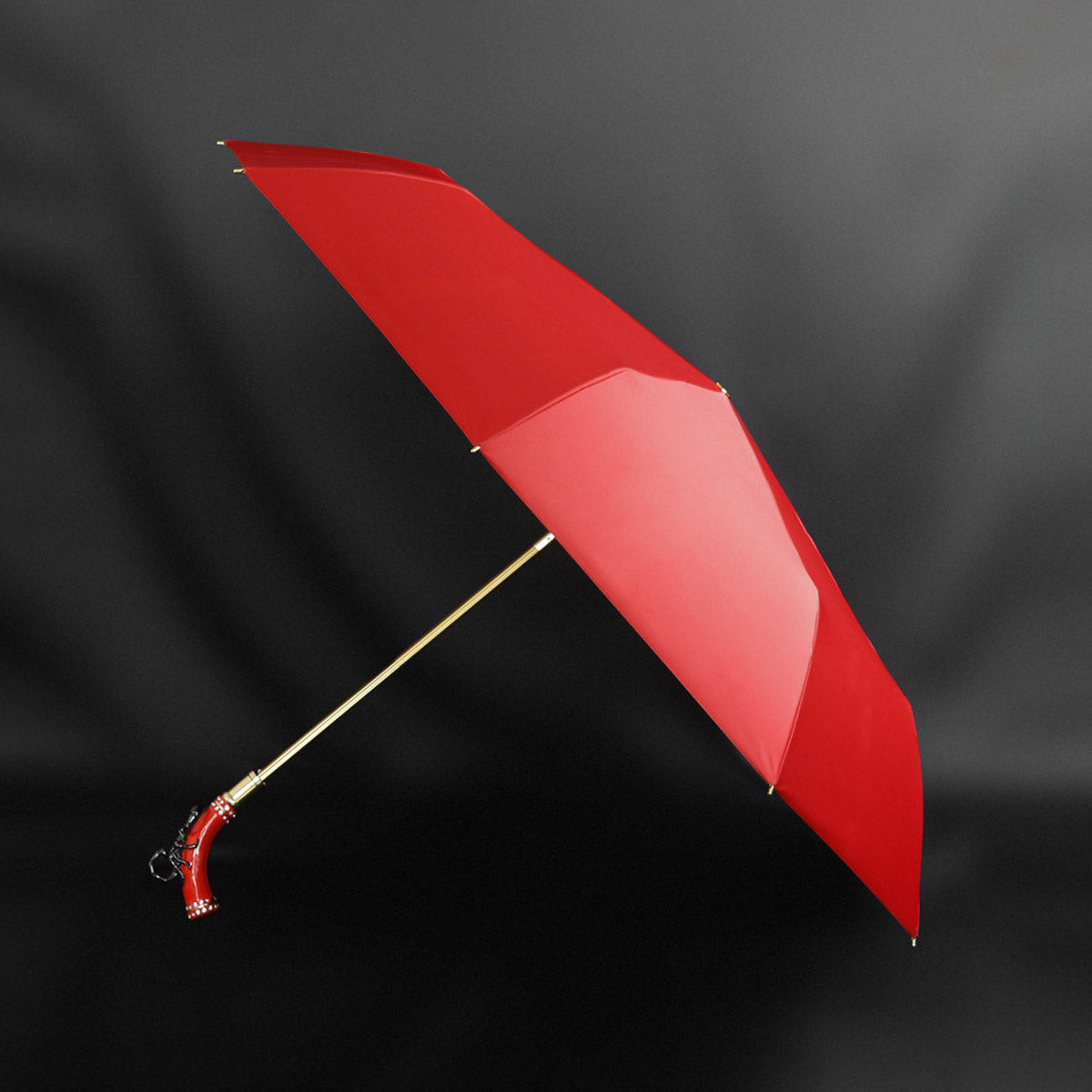 Fashionable red umbrella with scorpion handle - chic and compact parasol