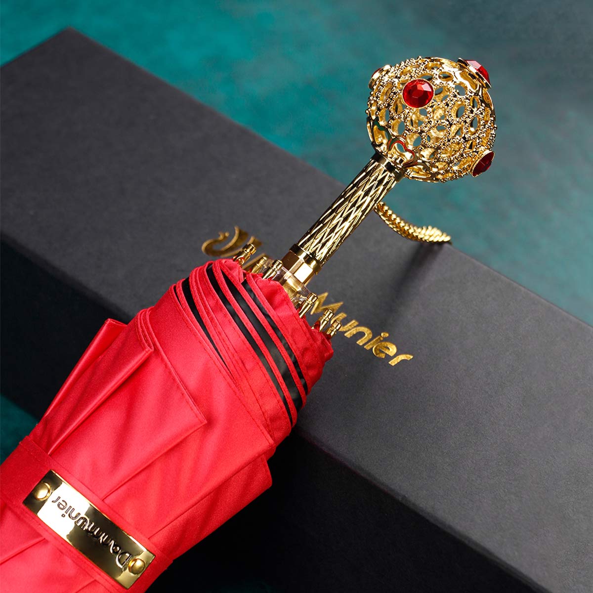 Red Prestige folding umbrella with gold crystal handle, luxury gift box packaging presentation