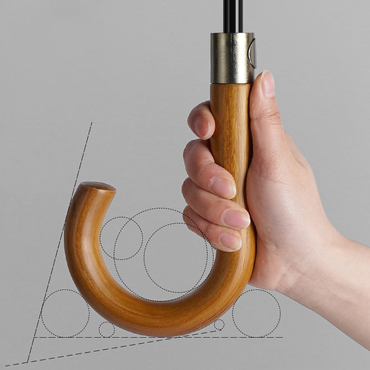 Close-up of durable wooden handle on windproof umbrella